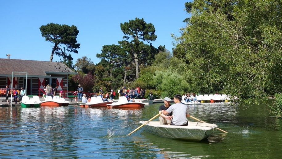 People boating on a lake in Queens park in Mablethorpe