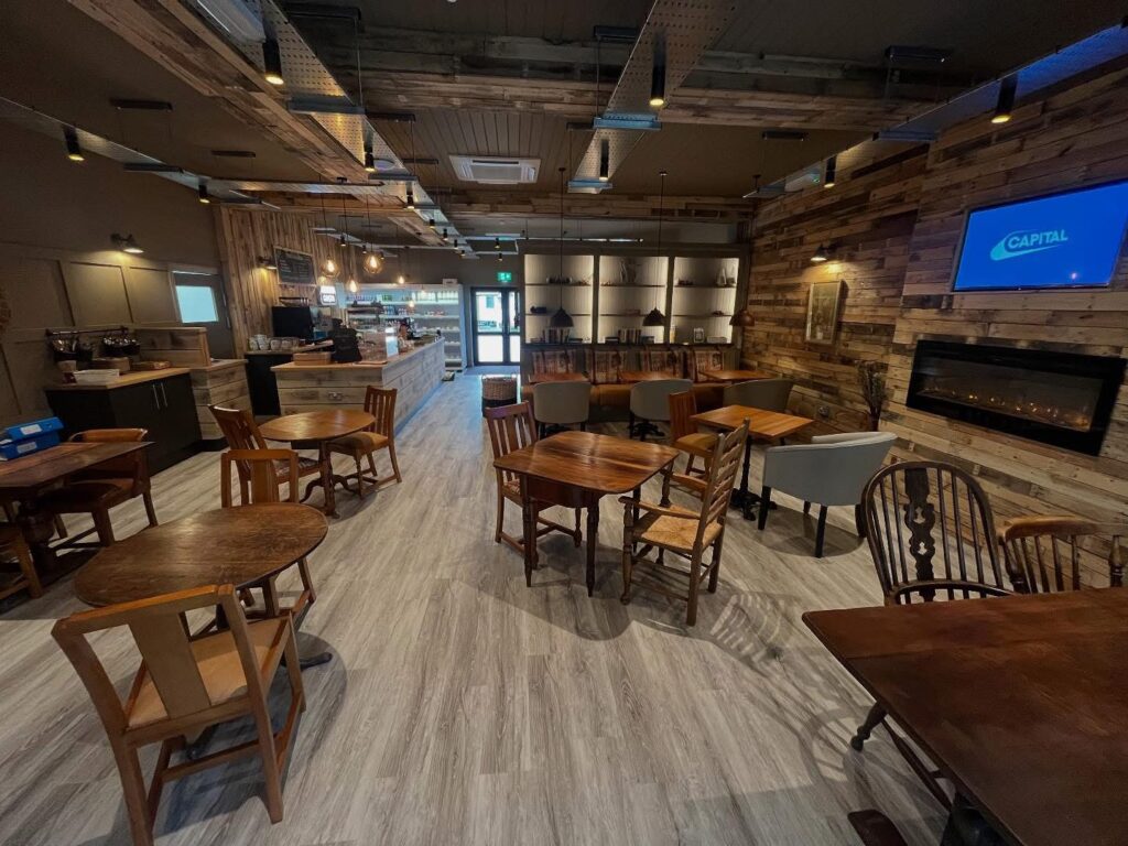 The toast cafe at Lakeside Park with wooden tables and chairs