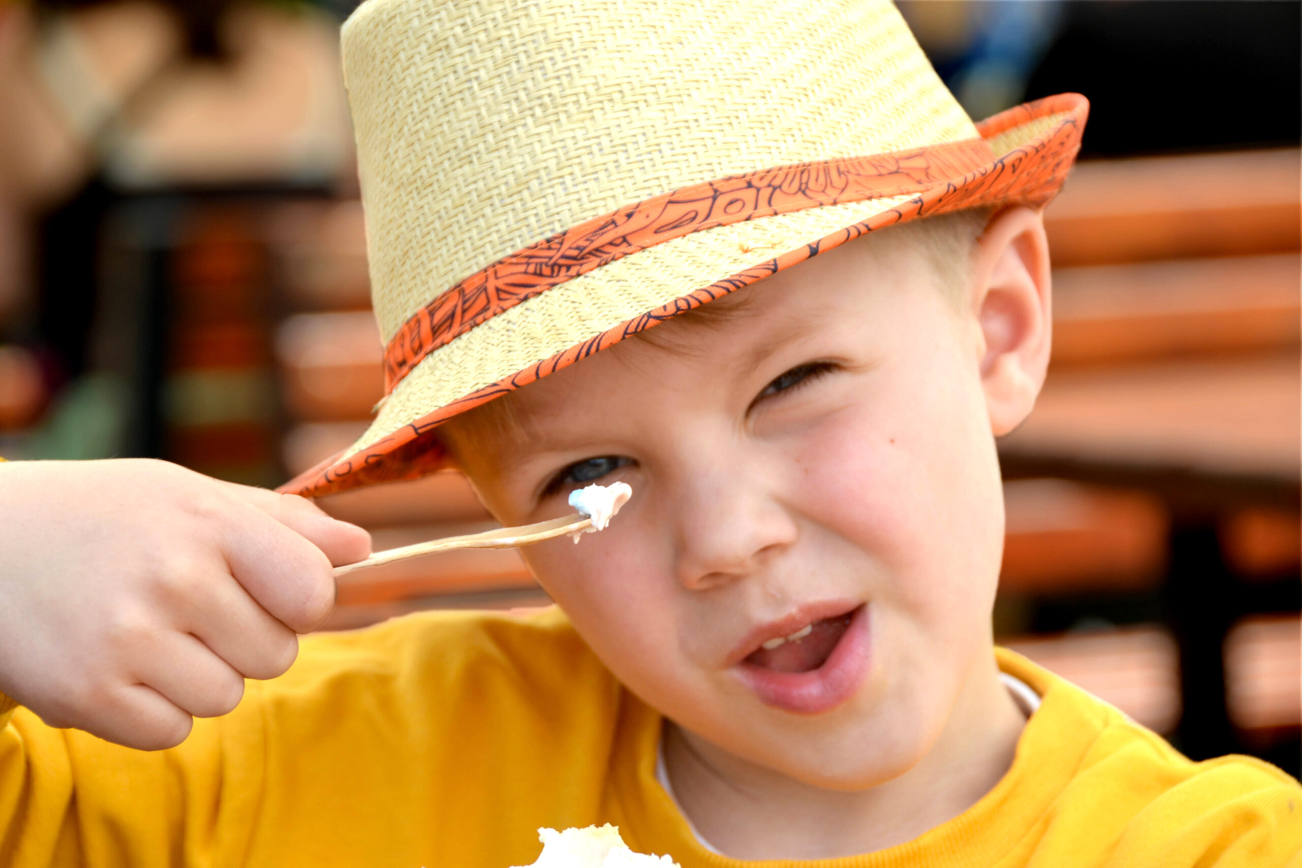 A boy eating ice cream on a beach in Cleethorpes