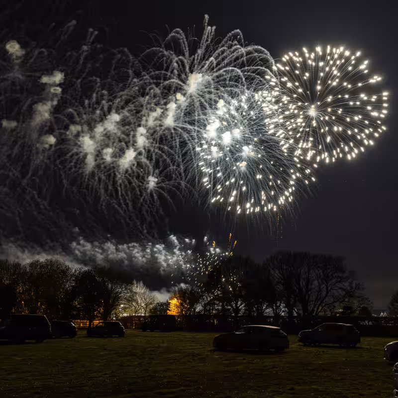 a firework show over a field in lincolnshire