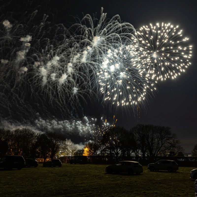a firework show over a field in lincolnshire
